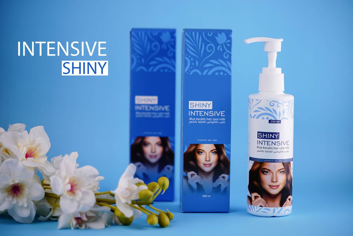woman applying hair conditioning serum to dry ends before styling